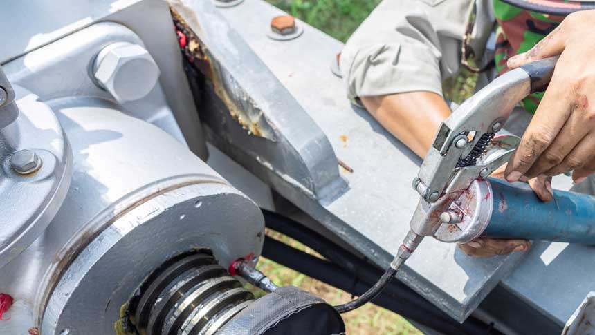 tractor grease with cordless grese gun