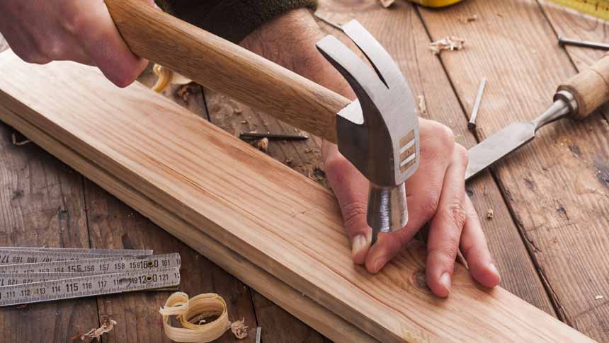 woodworker with hammers